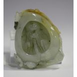 A Chinese carved jade pendant, 20th century, carved and pierced with a head and shoulders portrait