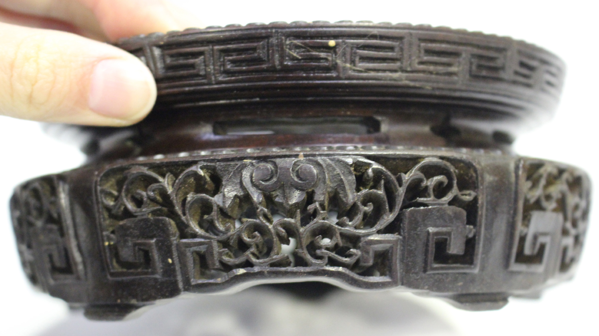 A Chinese hardwood circular stand, late 19th/early 20th century, carved with a keyfret and foliate - Image 3 of 19