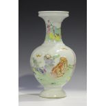 A Chinese famille rose enamelled porcelain vase, probably Yongzheng period, the bulbous body painted