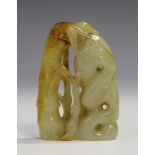 A Chinese carved and pierced jade finial, probably 20th century, formed as a bird perched on