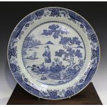 A large Chinese blue and white export porcelain circular dish, Qianlong period, the centre painted