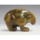 A Chinese carved agate figure of a rabbit, 20th century, modelled in a crouching pose, the stone