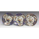 A set of four Chinese Imari export porcelain plates, Kangxi period, each painted and gilt with a