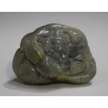 A Chinese pebble jade carving, early 20th century, one side carved in low relief with two rams