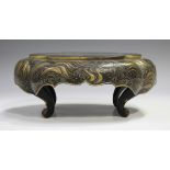 A Japanese lacquer stand, Meiji period, of lobed oblong form, the apron decorated with gilt waves on