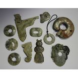 A collection of eleven Chinese archaistic pendants and carvings, 20th century and later, of