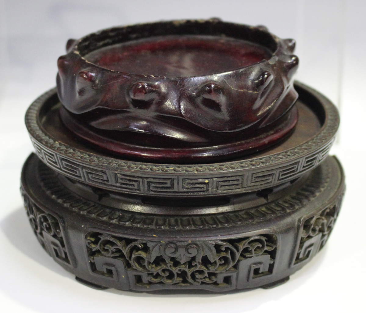 A Chinese hardwood circular stand, late 19th/early 20th century, carved with a keyfret and foliate - Image 4 of 19
