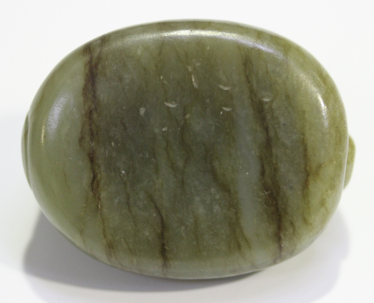 A Chinese carved celadon jade dragon pendant, 20th century, of oval shape, the stone with brown line - Image 6 of 10