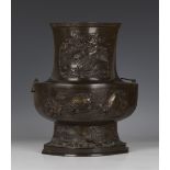 A Japanese brown patinated bronze vase, Meiji period, the baluster body of lozenge section, cast