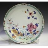 A Chinese famille rose export porcelain circular dish, Yongzheng/Qianlong period, painted with a