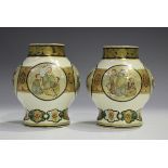 A pair of Japanese Satsuma earthenware vases by Taizan, Meiji period, each stout baluster body