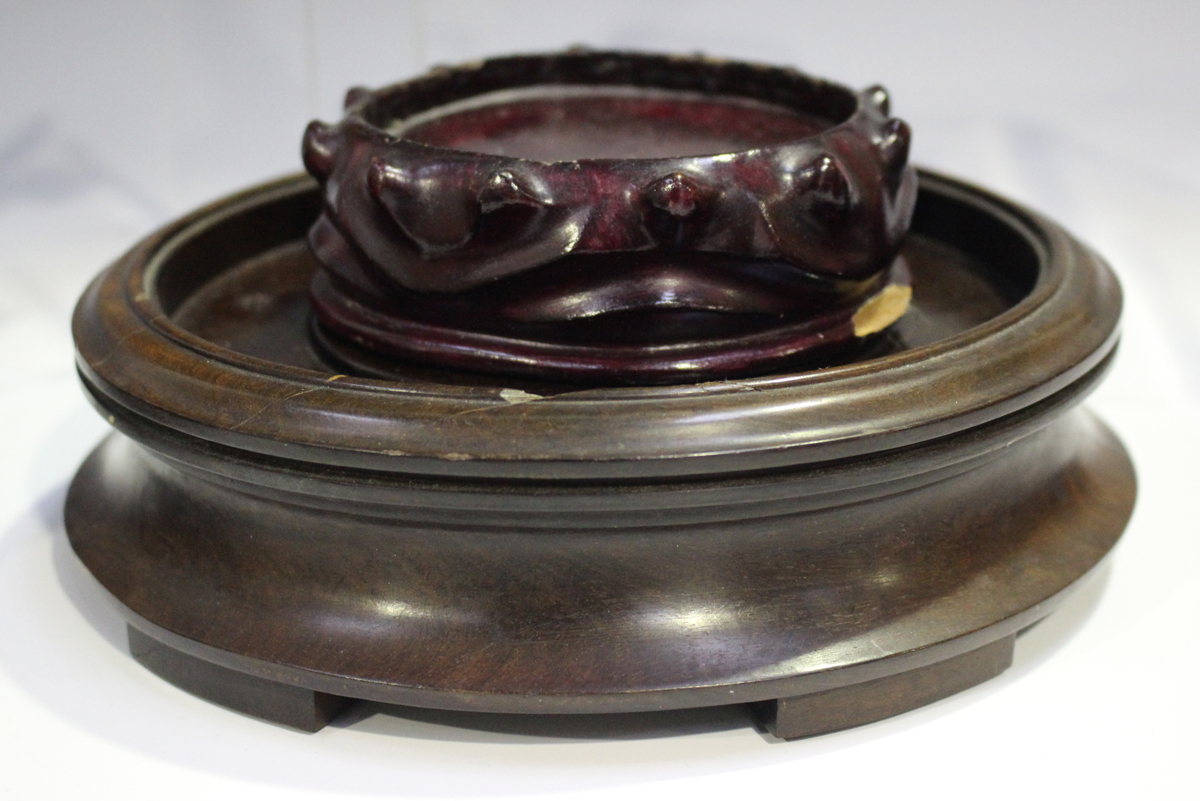 A Chinese hardwood circular stand, late 19th/early 20th century, carved with a keyfret and foliate - Image 14 of 19