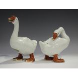 A pair of Chinese porcelain models of geese, early 20th century, one preening itself, the other
