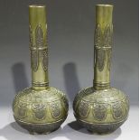 A pair of Chinese brown patinated bronze bottle vases, late Qing dynasty, each globular body cast