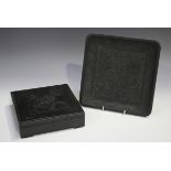 A Chinese black stone ink stone box and cover, late 19th century/early 20th century, of square form,