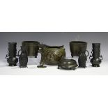 A pair of Chinese archaistic brown patinated bronze vases, late Qing dynasty, each globular body and