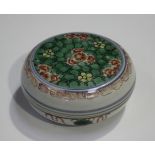 A Chinese famille verte porcelain circular box and cover, Kangxi period, the top painted with a