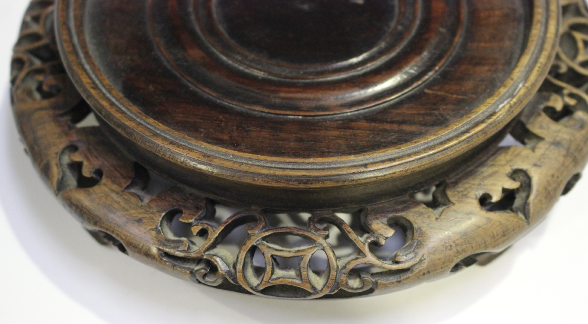 A Chinese hardwood circular stand, late 19th/early 20th century, carved with a keyfret and foliate - Image 9 of 19