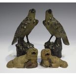 A pair of Chinese pottery figures of birds, 20th century, each modelled perched on a rocky