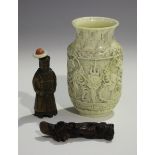 A Chinese Canton export ivory vase, late Qing dynasty, carved in low relief with dragons and a