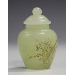 A Chinese pale celadon jade snuff jar and cover, probably 20th century, of well-hollowed flattened