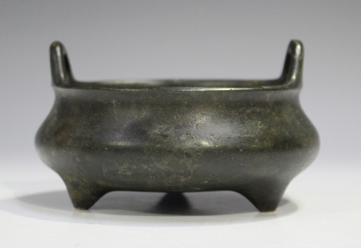A Chinese brown patinated bronze tripod censer, mark of Xuande but probably Qing dynasty, of
