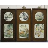 A near set of three Chinese porcelain panels, 20th century, each with a rectangular panel painted