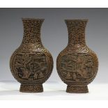 A pair of Chinese cinnabar lacquer vases, late Qing dynasty, each flattened circular body carved