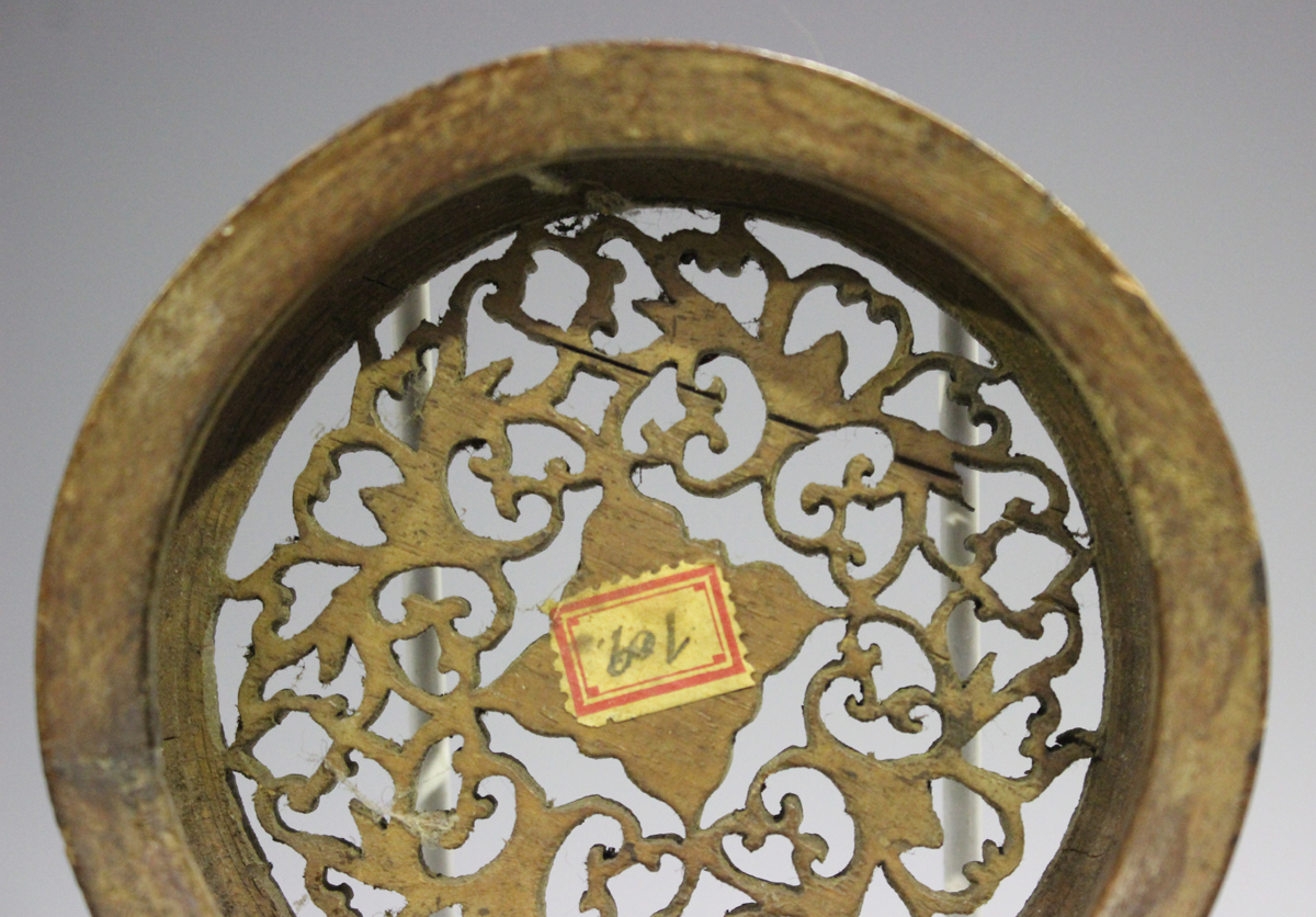 A Chinese hardwood circular stand, late 19th/early 20th century, carved with a keyfret and foliate - Image 18 of 19