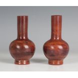 A pair of Lithyalin glass bottle vases, 19th century, the globular bodies with cylindrical necks, of