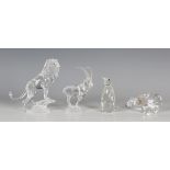 Two Swarovski Crystal Rare Encounter Collection animals, comprising lion on rock, designed by Martin