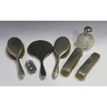 A George V silver five-piece dressing table set with engine turned decoration, monogram engraved,