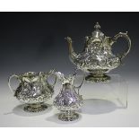 A mid-Victorian silver three-piece tea set, comprising teapot, milk jug and two handled sugar