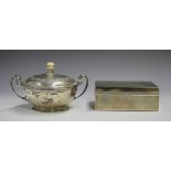 A George V silver two-handled circular bowl and cover with ivory finial and engraved foliate border,