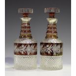 A pair of silver mounted ruby flashed cut glass decanters and stoppers, London 1972 by C.J. Vander