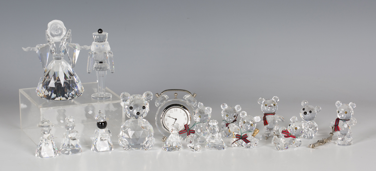 Six Swarovski Crystal Kris bears, comprising bear with clock, bear skiing, bear ice skating, bear