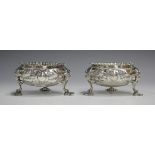 A pair of early Victorian silver circular salts, each with cast scalloped rim, the sides embossed