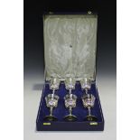 A set of six Elizabeth II silver goblets, each tapered bowl with band of ovals and strapwork, gilt