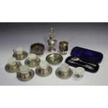 A small group of silver items, comprising a George V silver octagonal baluster sugar caster,