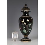 An enamelled black glass vase and cover, circa 1900, the ovoid body with a winged insect amidst wild
