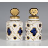 A pair of white overlaid Bohemian blue glass scent bottles and stoppers, late 19th century, of