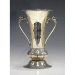 A George V silver trumpet vase, the gadrooned rim above a pair of lion mask and tongue downswept