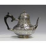 A mid-18th century Dutch silver teapot of low-bellied baluster form, the domed lid with knop finial,