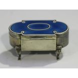 An Edwardian silver and enamel jewellery box of lobed rectangular form, the hinged lid with