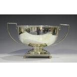 A George V silver two-handled trophy bowl with reeded rims and handles, the circular body with