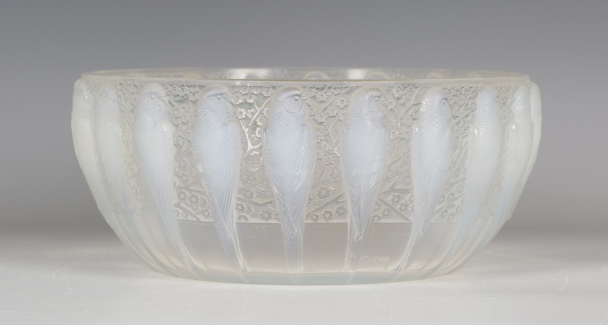 An Art Deco Lalique opalescent glass Perruches pattern bowl, circa 1931, the exterior moulded with a