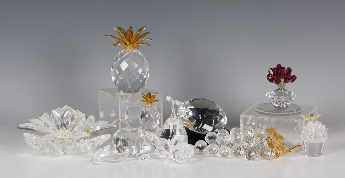 A group of Swarovski Crystal flowers and fruit, including a Secret Garden Collection maxi flower