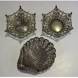 A late Victorian silver bonbon dish of scallop shell form with pierced and embossed decoration,
