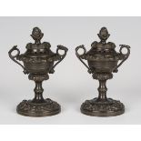 A pair of Regency dark brown patinated bronze pastille burners, the lids with pineapple finials