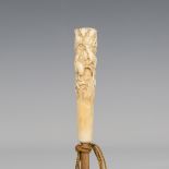 A late 19th century Japanese ivory walking cane handle, carved in relief with overall rats, length